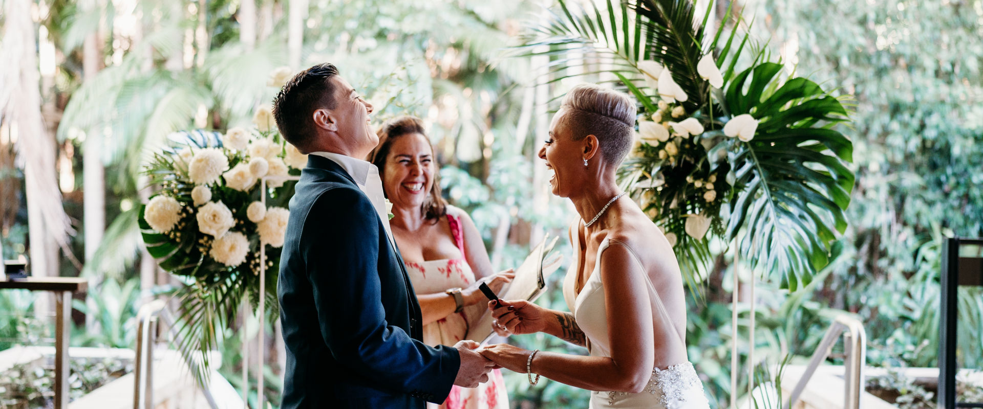 Wedding couple laughing with marriage celebrant Chiquita Mitchell